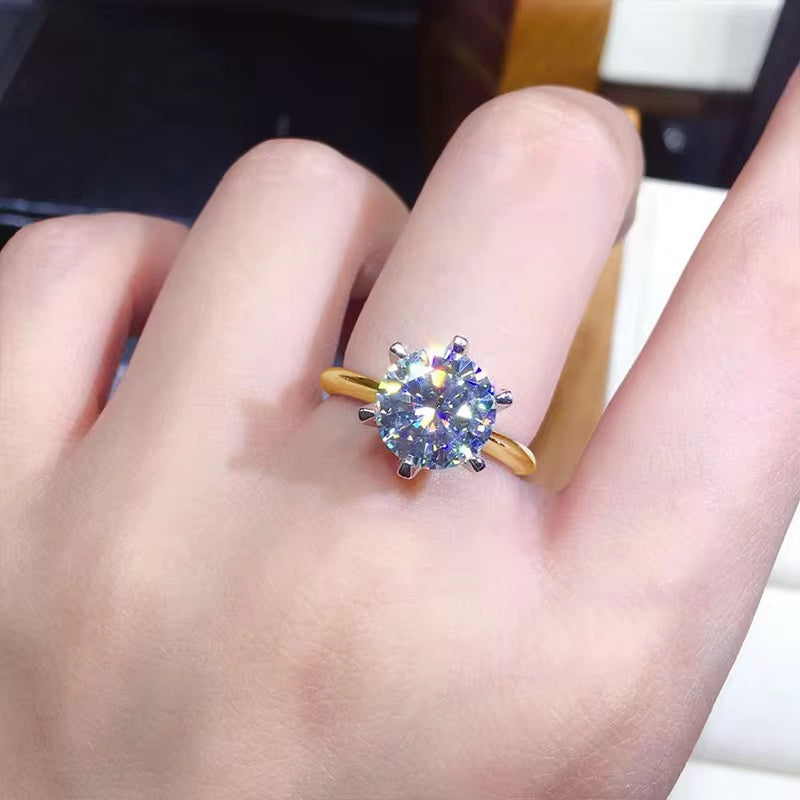 Celebrate the Season with the Shavano Vintage Sexy 18K Golden Plated 925 Sterling Silver Moissanite Engagement Ring. This stunning piece is the perfect Spring Festival gift, ideal for the Spring season, vacation occasions, and gift-giving. The 6 Prong