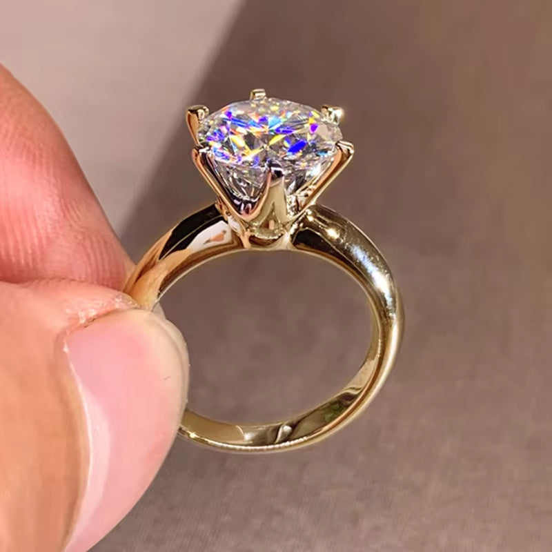 Celebrate the Season with the Shavano Vintage Sexy 18K Golden Plated 925 Sterling Silver Moissanite Engagement Ring. This stunning piece is the perfect Spring Festival gift, ideal for the Spring season, vacation occasions, and gift-giving. The 6 Prong