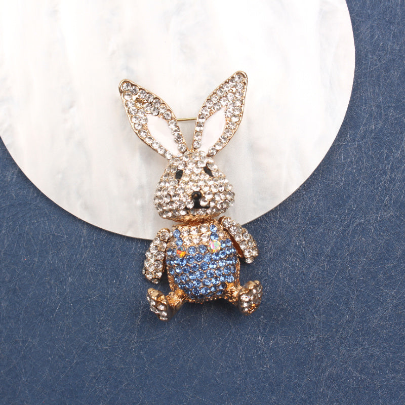 Chic Rabbit brooch adorned with rhinestones, cute enamel pin in animal shape with glistening diamonds, unique novelty lapel pin resembling simulation modeling for holiday gifting.