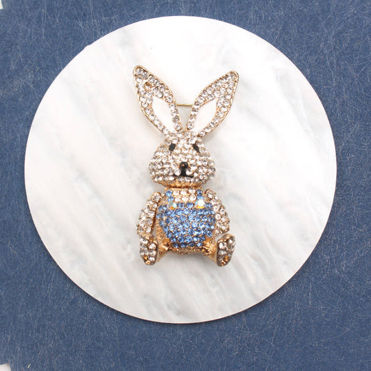 Chic Rabbit brooch adorned with rhinestones, cute enamel pin in animal shape with glistening diamonds, unique novelty lapel pin resembling simulation modeling for holiday gifting.