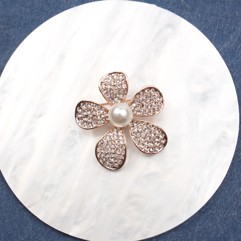 Sophisticated Floral Enamel Brooch adorned with Rhinestones and a Shimmering Pearlescent Center. This Charming Fashion Accessory is a Unique and Irregular Flower Pin perfect for Women's Clothing.