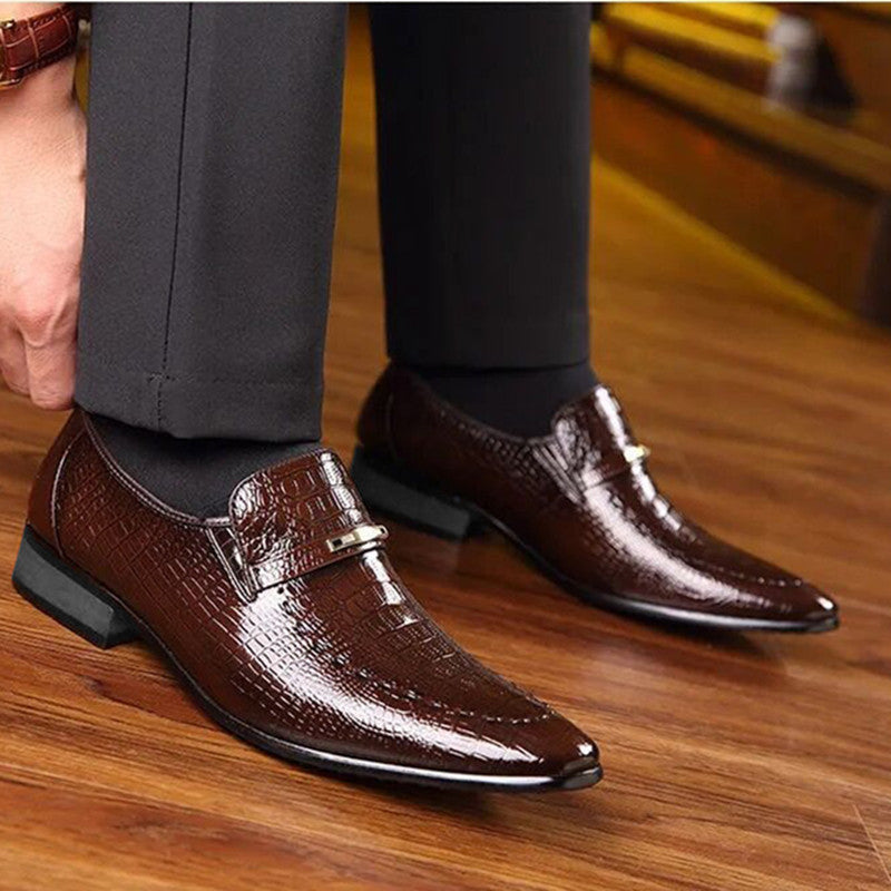 Brown penny loafers for men featuring crocodile texture, metallic buckle, suitable for business, office, parties, weddings.