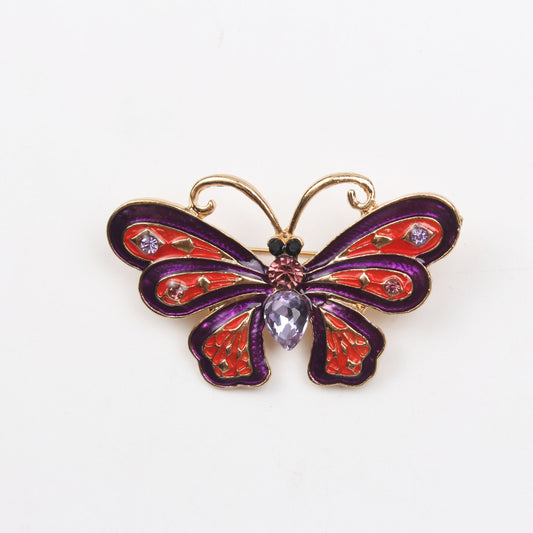 Vintage and elegant, this enamel butterfly brooch is a unique and stylish piece of simulation jewelry. Perfect for adding a touch of fashion to a woman's suit coat or corsage, this exquisite insect pin is an ideal holiday gift.