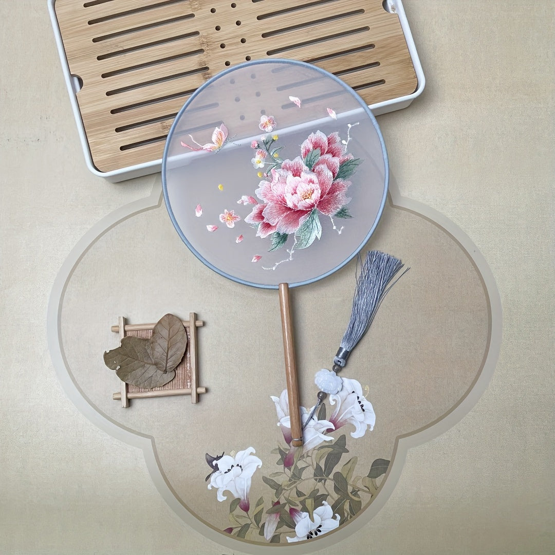 Beautifully crafted Chinese style silk embroidered fan with decorative tassel flower, perfect for use at home, while traveling, in school, or in the office.