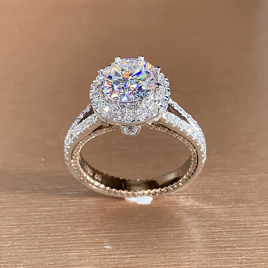 Elevate your style with the 1pc LOVESSOM 925 Sterling Silver Moissanite Engagement Ring. Featuring a dazzling 2 carat round cut stone, this elegant and luxurious piece is perfect for women looking for a stunning accessory for any occasion, whether it be