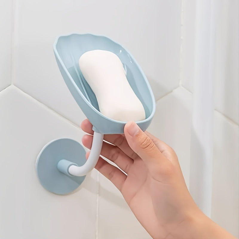 Wall-mounted, self-draining soap dish with lotus leaf design, for bathroom or kitchen. No-hole installation, plastic material.