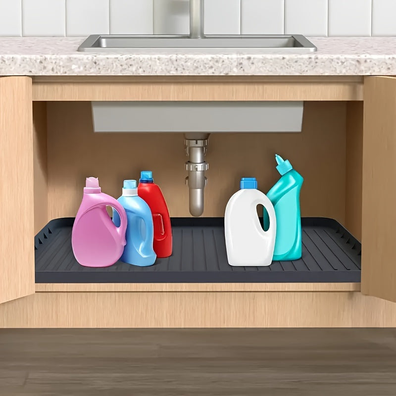 One silicone sink mat, designed for multiple uses without contact with food. This durable plastic liner fits under sinks in kitchens and bathrooms, providing easy-to-clean protection for cabinet storage. The utility tray protector measures 32.0cm x