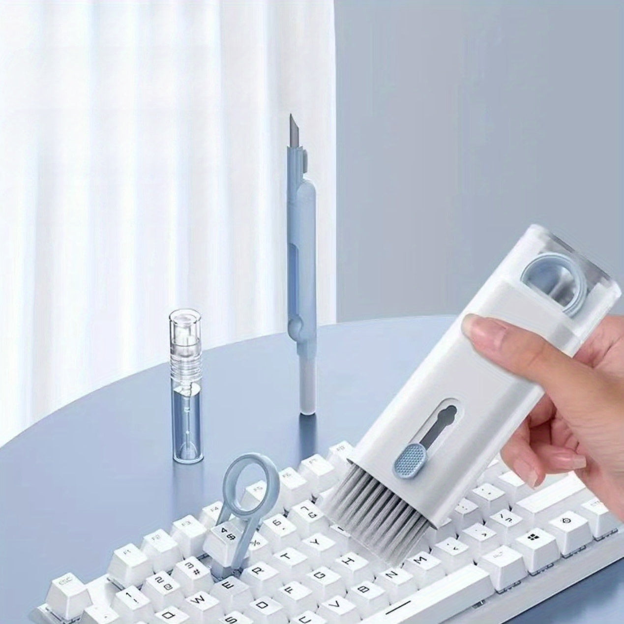 Multifunctional cleaning set for keyboards, earphones, mobile screens, and keycaps.