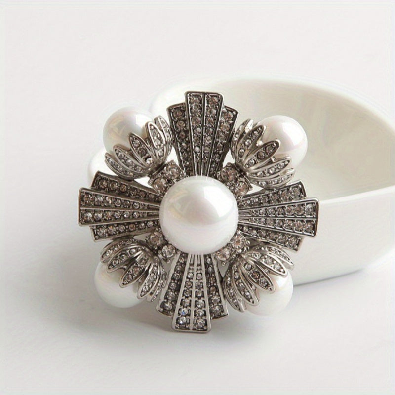 The stunning Enamel Flower Brooch, adorned with countless shimmering rhinestones and complemented by sophisticated imitation pearls, is a chic and trendy piece of jewelry for women that also makes the perfect gift. This versatile accessory pairs