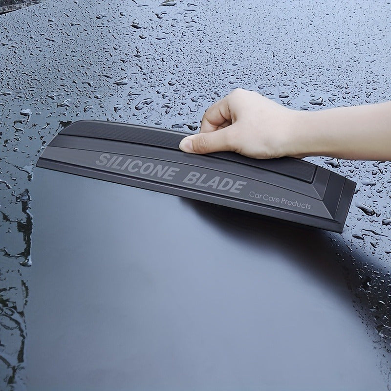 Flexible silicone car water squeegee for streak-free drying and winter car care.