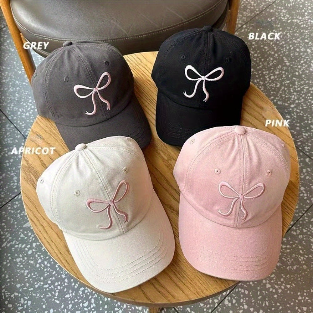 Adjustable bowknot baseball cap in sweet pink design, made of lightweight polyester. Comes in black, grey, apricot, and pink for casual wear.