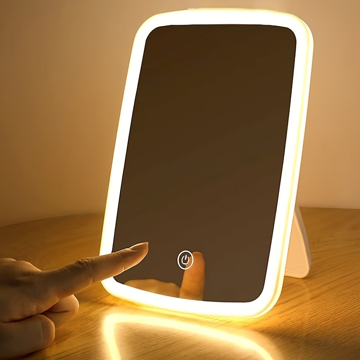 Portable folding LED makeup mirror with touch sensor, adjustable brightness, lithium battery, USB charging, and polished flower design - ideal for travel.