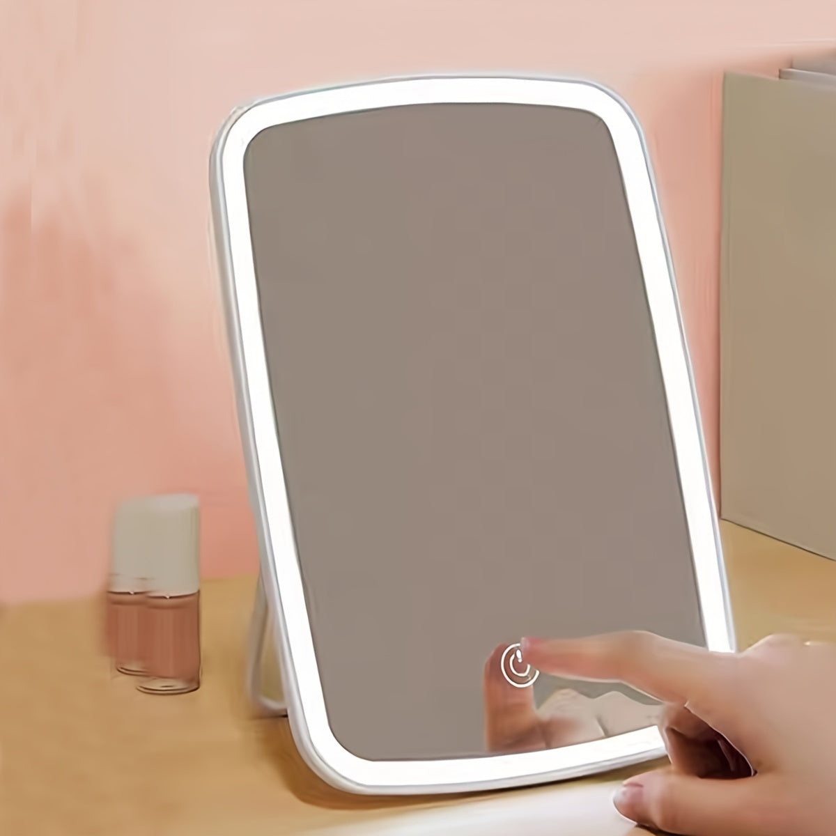 Travel friendly LED makeup mirror with touch sensor, three lighting modes, adjustable brightness, sleek design, and polished finish.