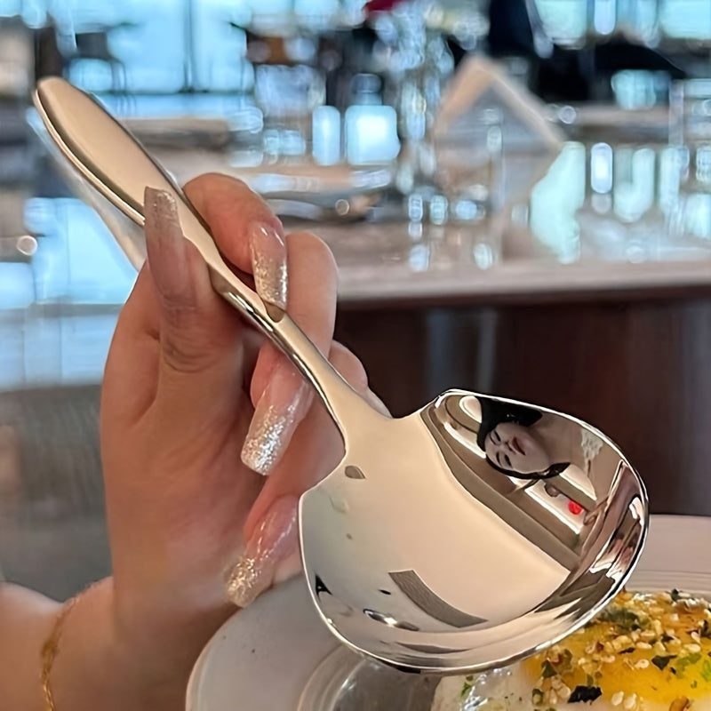 Durable stainless steel serving spoon with ergonomic handle for kitchen, dining, and restaurant use.