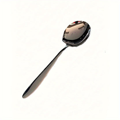 Durable stainless steel serving spoon with ergonomic handle for kitchen, dining, and restaurant use.