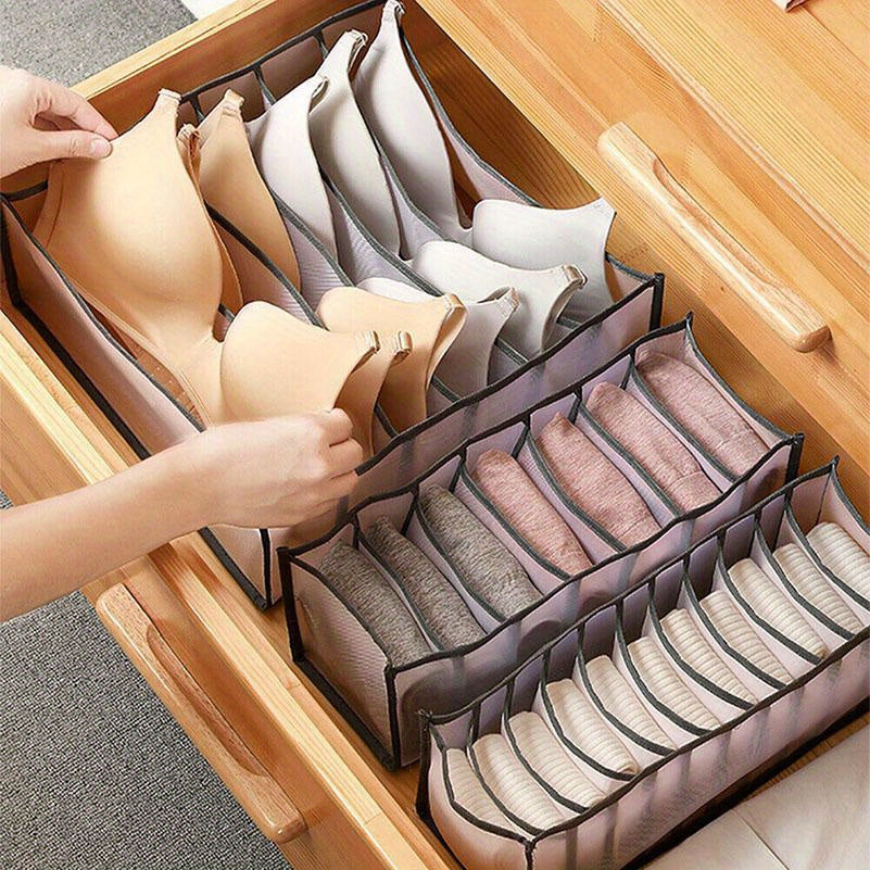 Set of three nylon mesh drawer organizers with 6, 7, and 11 grids. These foldable boxes are designed for storing underwear, socks, and bras. They feature a brushed finish and can be easily inserted into wardrobe closets to separate your items.