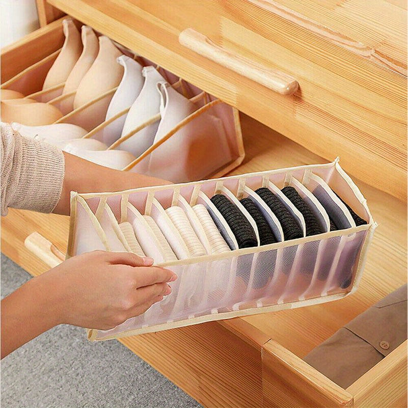 Set of three nylon mesh drawer organizers with 6, 7, and 11 grids. These foldable boxes are designed for storing underwear, socks, and bras. They feature a brushed finish and can be easily inserted into wardrobe closets to separate your items.