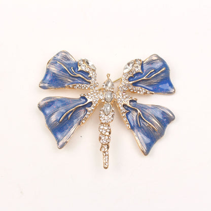 Chic Enamel Dragonfly Brooch adorned with Rhinestones, Unique Shape Fashion Pin for Clothing and Festive Gifts, exuding Luxury and Elegance.