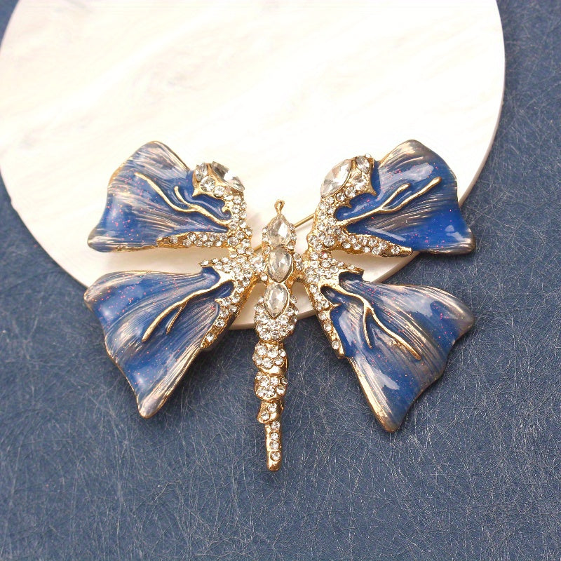 Chic Enamel Dragonfly Brooch adorned with Rhinestones, Unique Shape Fashion Pin for Clothing and Festive Gifts, exuding Luxury and Elegance.