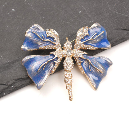 Chic Enamel Dragonfly Brooch adorned with Rhinestones, Unique Shape Fashion Pin for Clothing and Festive Gifts, exuding Luxury and Elegance.