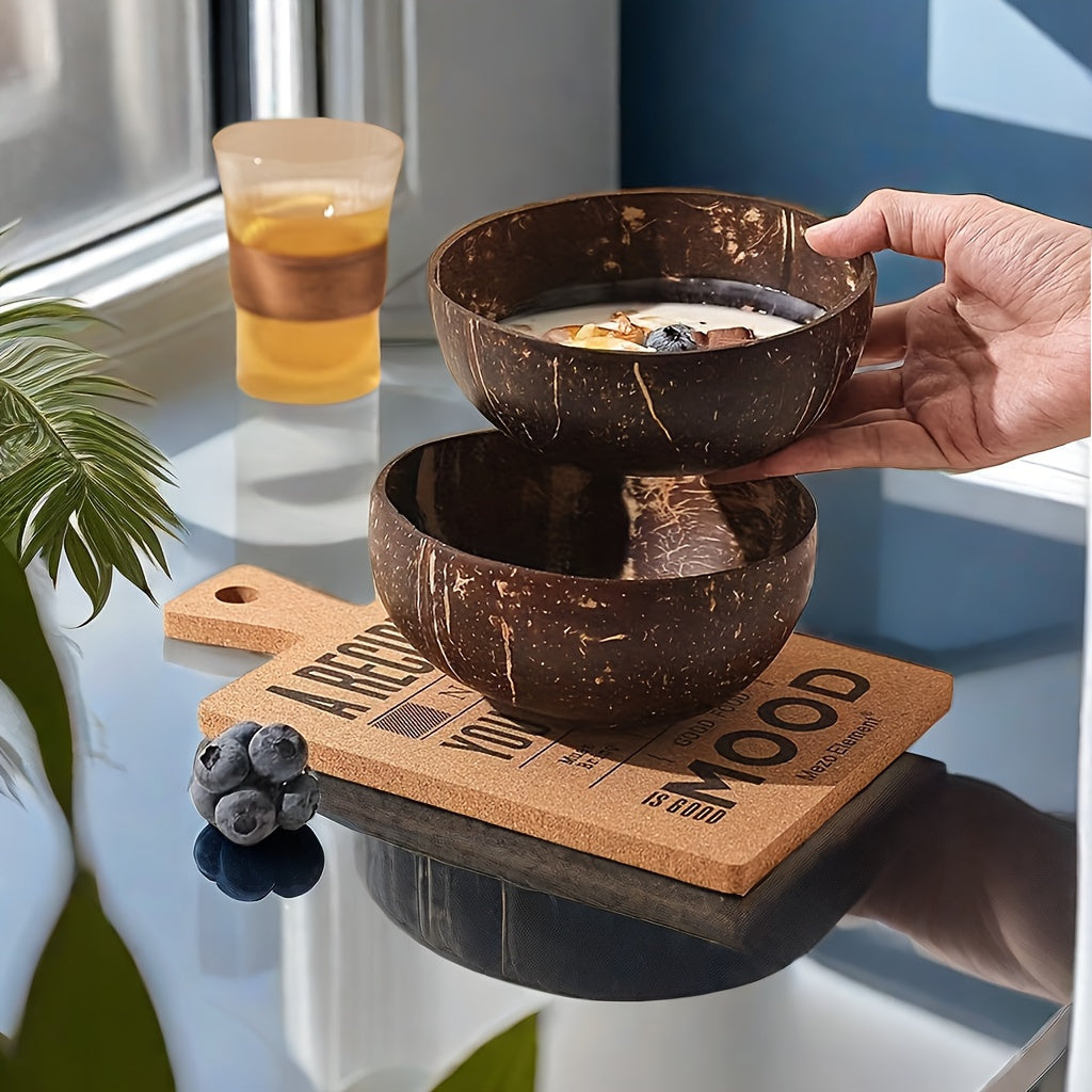 Set of two handcrafted coconut shell salad bowls with matching wooden spoons - Eco-friendly and ideal for serving salads, fruits, and cereals