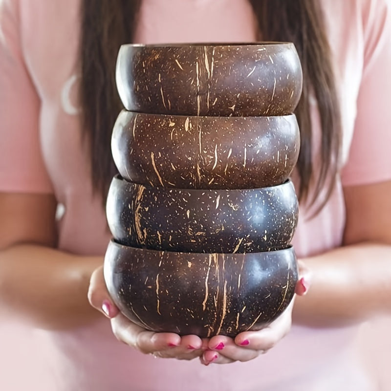 Set of two handcrafted coconut shell salad bowls with matching wooden spoons - Eco-friendly and ideal for serving salads, fruits, and cereals