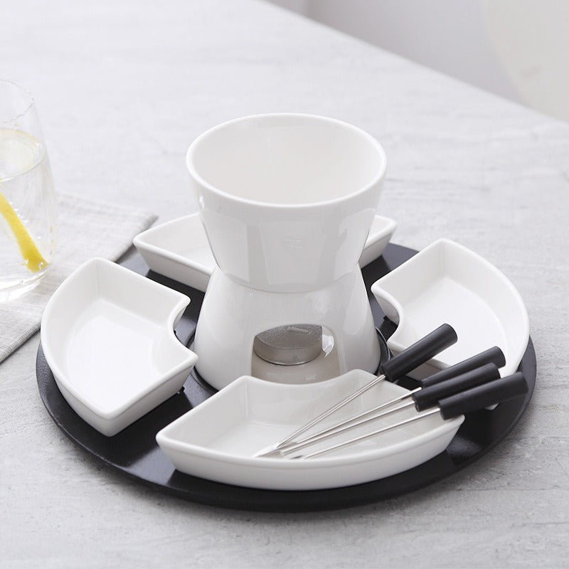 Ceramic fondue set for melting cheese, chocolate, butter, and caramel, includes 4 forks and dishes.