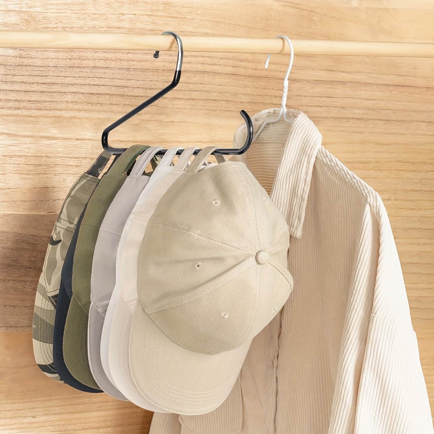 This black two-pack baseball cap hanger set is a versatile combination of metal and plastic. Perfect for organizing your wardrobe or for portable hat storage, each hanger can hold up to 20 hats of all types and sizes.