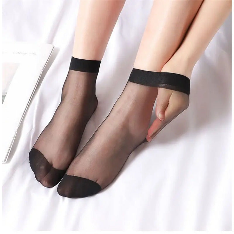 50 pairs of transparent ultrathin summer socks for women made of nylon, with short ankle length and elastic band. These socks are perfect for spring and summer wear.