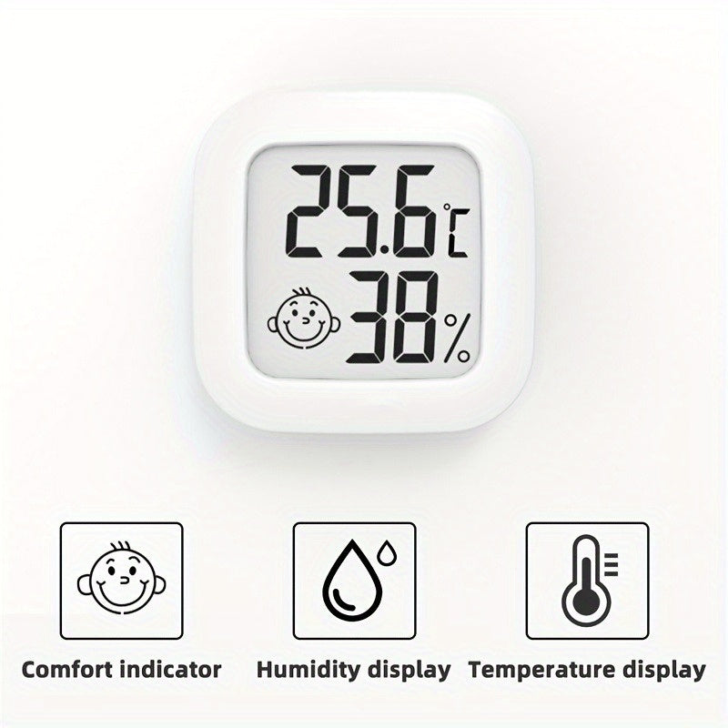 Compact Smart Smile Mini Digital Thermometer with LCD Display provides fast, accurate room temperature and humidity monitoring with included battery. Ideal for indoor use.