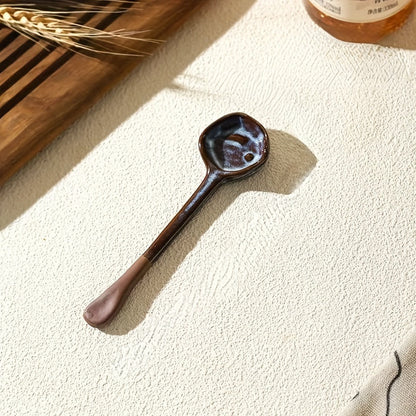 This long-handled Japanese ceramic coffee spoon has a rustic charm and is ideal for stirring tea or coffee. Made of heat-resistant ceramic material, it serves as a stylish accessory for your kitchen and dining experience.