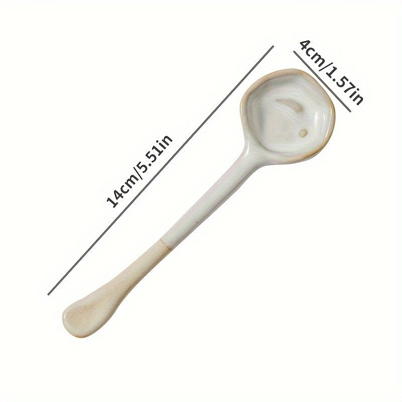 This long-handled Japanese ceramic coffee spoon has a rustic charm and is ideal for stirring tea or coffee. Made of heat-resistant ceramic material, it serves as a stylish accessory for your kitchen and dining experience.