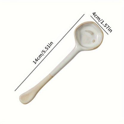 This long-handled Japanese ceramic coffee spoon has a rustic charm and is ideal for stirring tea or coffee. Made of heat-resistant ceramic material, it serves as a stylish accessory for your kitchen and dining experience.