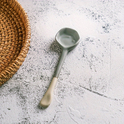 This long-handled Japanese ceramic coffee spoon has a rustic charm and is ideal for stirring tea or coffee. Made of heat-resistant ceramic material, it serves as a stylish accessory for your kitchen and dining experience.