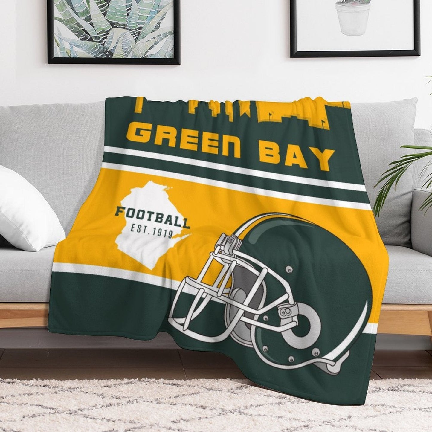 Blanket that can be personalized with the name of your choice and features the Green Bay football team. Made from cozy polyester, this throw blanket is the perfect gift for fans.