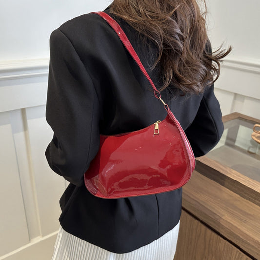 Chic red shoulder bag with glossy finish, golden zipper closure for daily wear