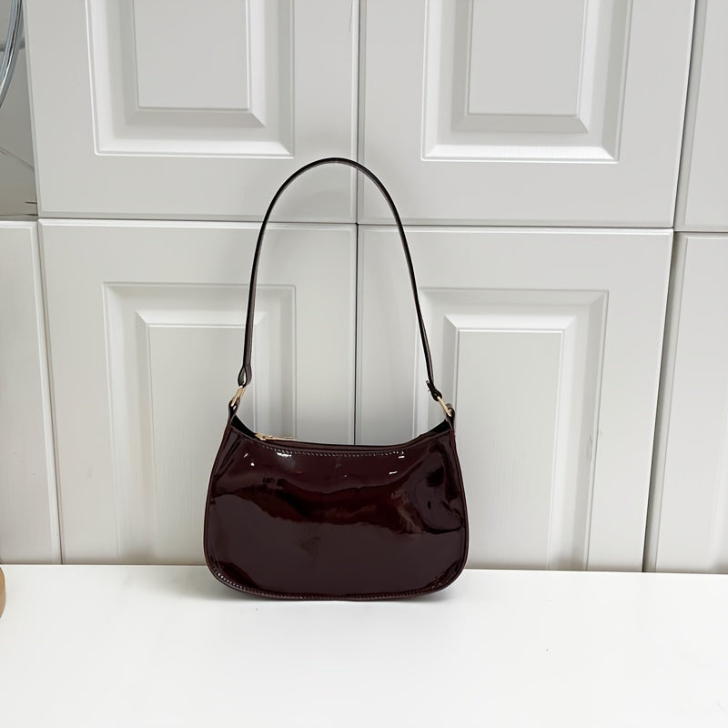 Chic red shoulder bag with glossy finish, golden zipper closure for daily wear