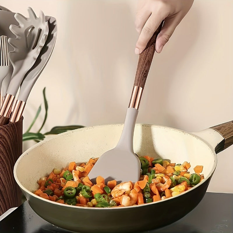 Essential for home chefs, this premium silicone spatula features a stylish wood grain handle. Heat-resistant, non-stick safe, and perfect for cooking and baking.