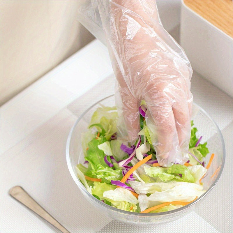 200 pieces of disposable plastic gloves made from waterproof PET (Polyethylene Terephthalate), free from lead. Ideal for cooking, food preparation, BBQ, kitchen use, restaurant service, and craft making.