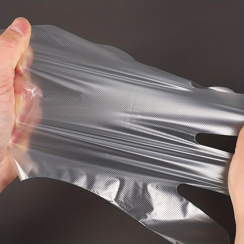 200 pieces of disposable plastic gloves made from waterproof PET (Polyethylene Terephthalate), free from lead. Ideal for cooking, food preparation, BBQ, kitchen use, restaurant service, and craft making.