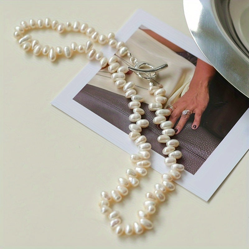 Add a touch of elegance to your wardrobe with this stunning Elegant French Style Freshwater Pearl Necklace for Women. Perfect for parties and everyday wear, this luxurious and delicate accessory is sure to elevate any outfit. Each pearl features natural