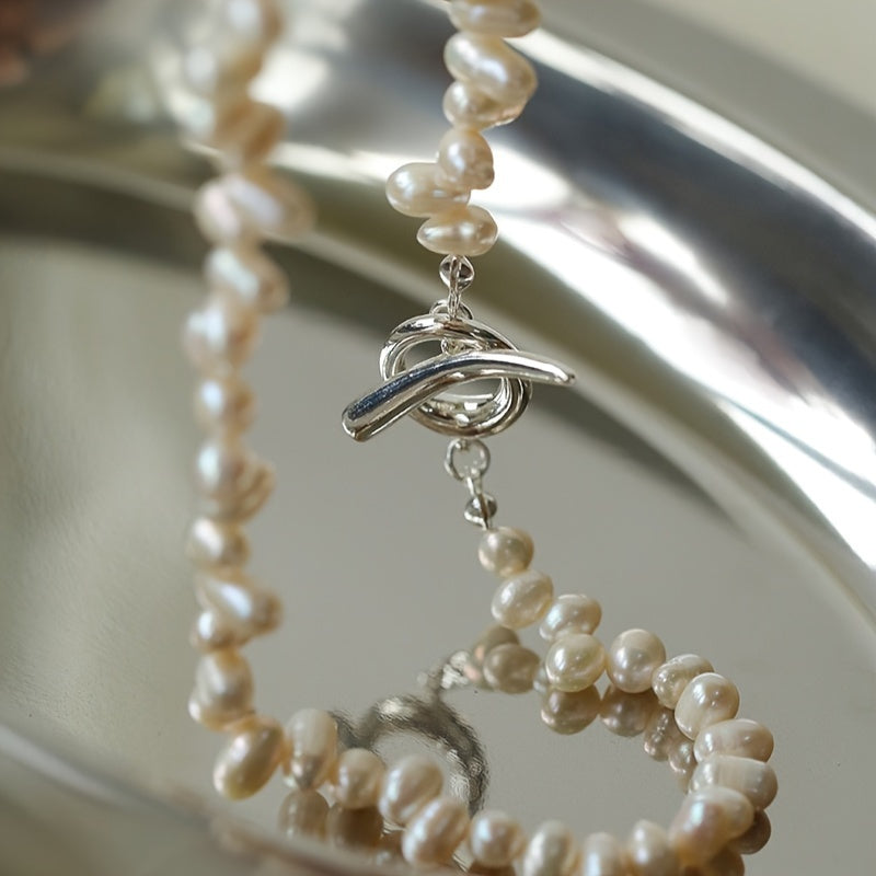 Add a touch of elegance to your wardrobe with this stunning Elegant French Style Freshwater Pearl Necklace for Women. Perfect for parties and everyday wear, this luxurious and delicate accessory is sure to elevate any outfit. Each pearl features natural