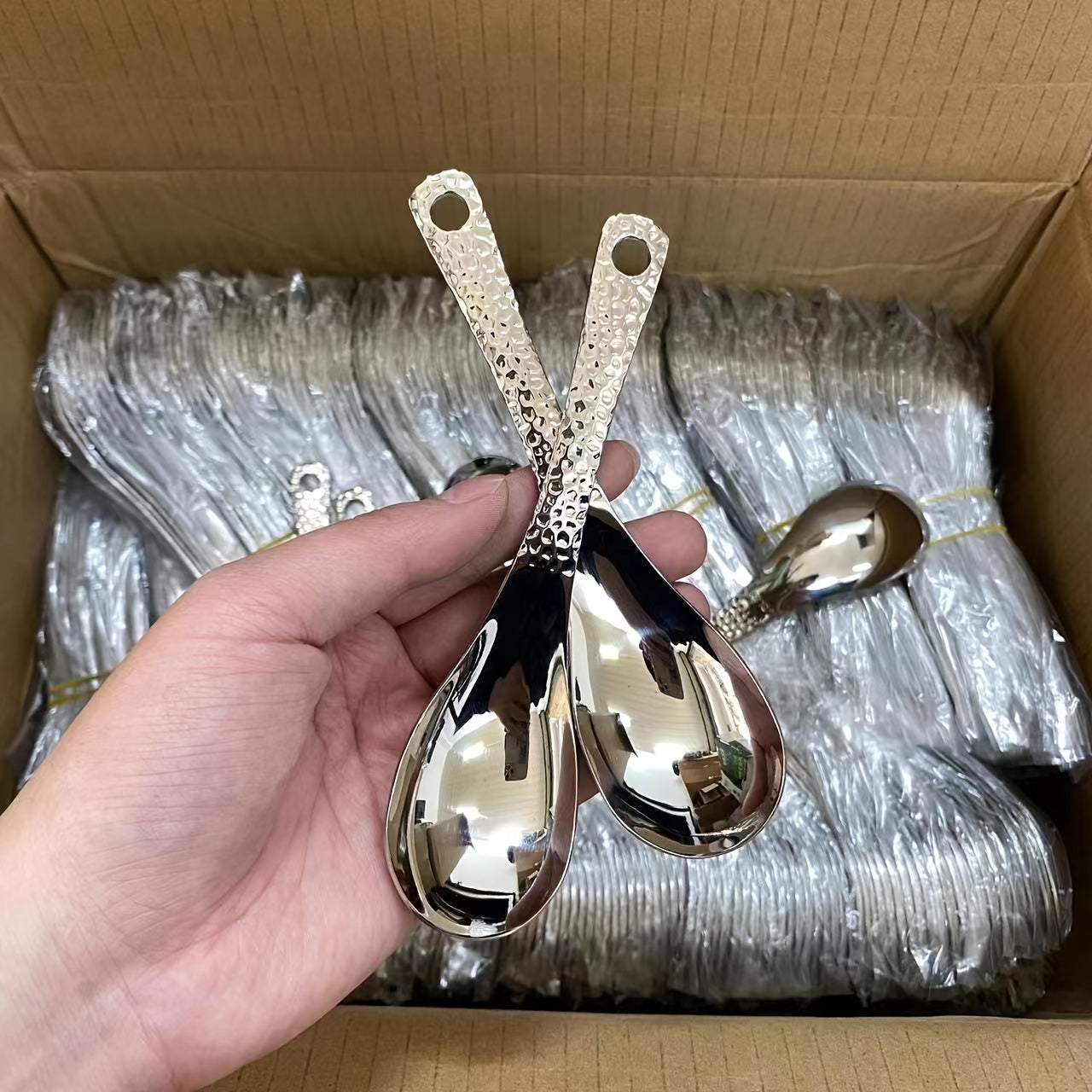 4-piece Vintage Hammered Stainless Steel Dessert Spoons Set with Hanging Storage Bag, perfect for home use.