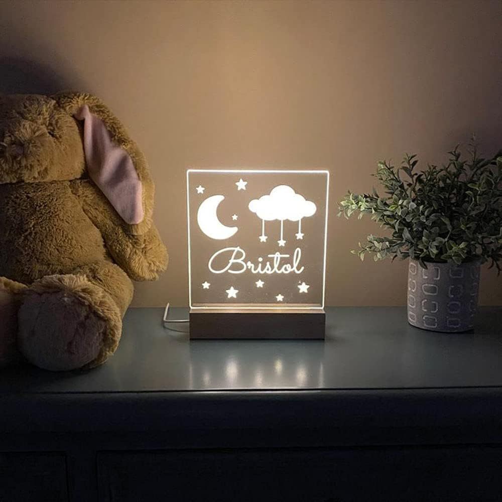 Make your space shine with our Custom LED Night Light featuring Moon and Stars design, personalized with your name. This decorative USB-powered desk light comes with easy button control, perfect for bedroom or game room ambiance. A thoughtful gift for