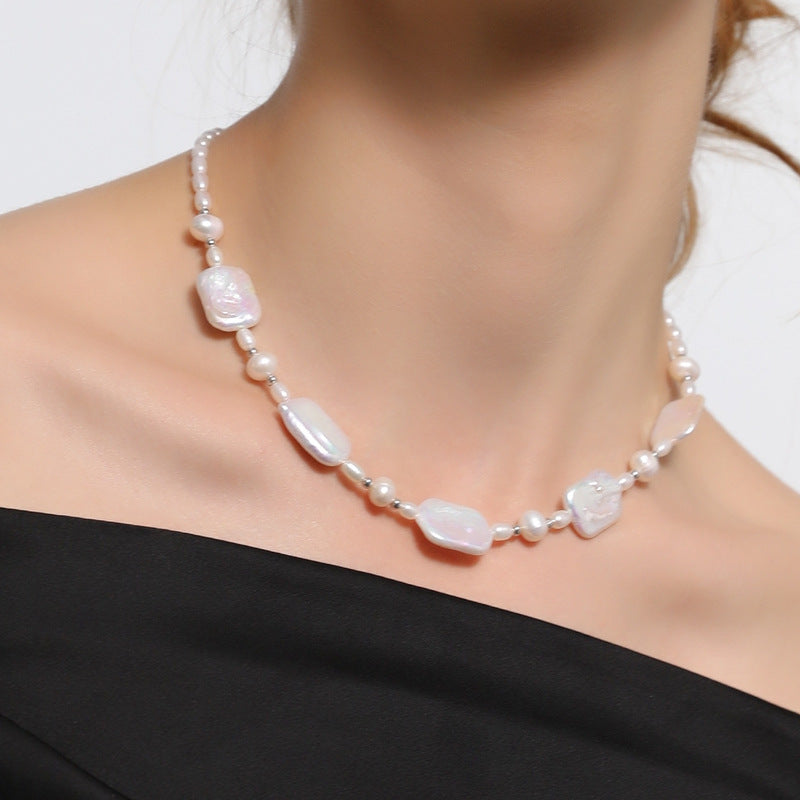 Elegant and fashionable, the ZAYCAN Baroque Art Pearl Necklace features a vintage petal design with natural freshwater pearls on a silvery body. This accessory adds a touch of vintage style to any outfit and is perfect for banquets, weddings, or as a