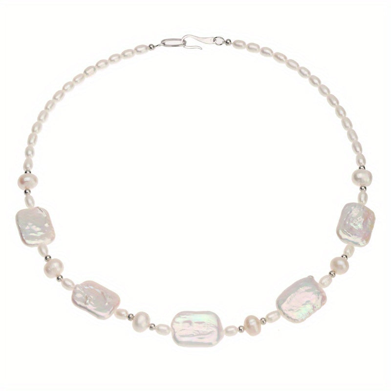 Elegant and fashionable, the ZAYCAN Baroque Art Pearl Necklace features a vintage petal design with natural freshwater pearls on a silvery body. This accessory adds a touch of vintage style to any outfit and is perfect for banquets, weddings, or as a