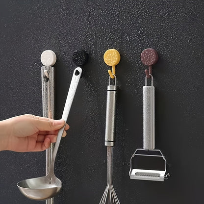 10 colorful adhesive hooks for easy wall-mounted storage in kitchen and bathroom, no drilling needed.