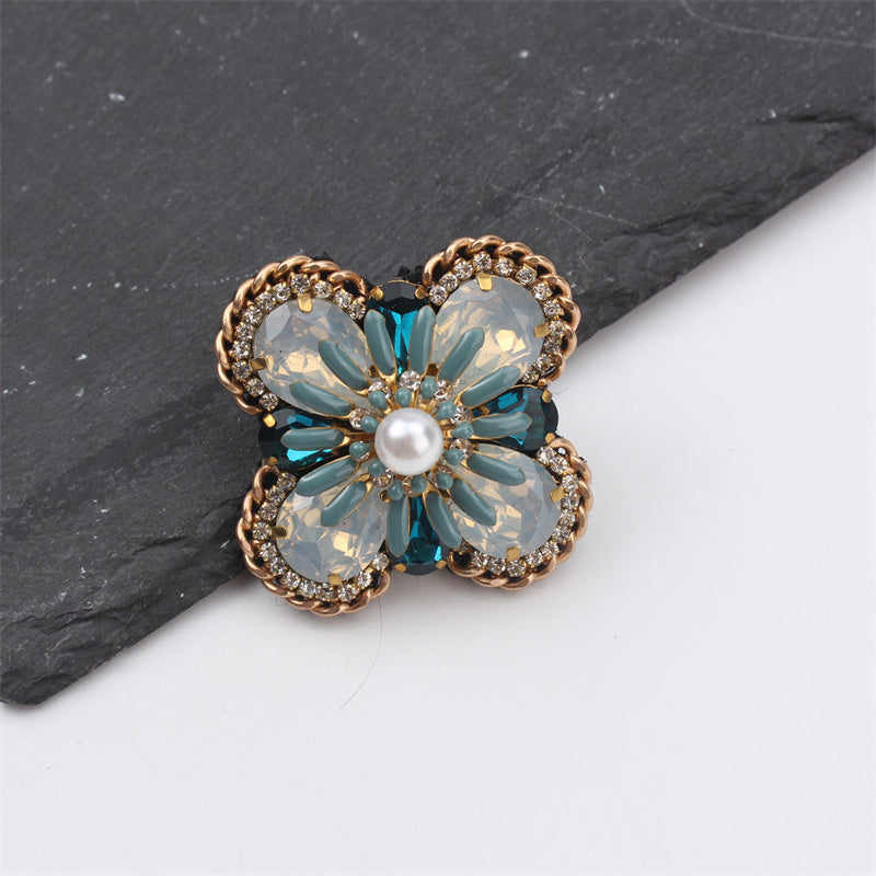 Creative statement jewelry with gemstone accents, a vintage-inspired bohemian floral enamel brooch pin designed for women.