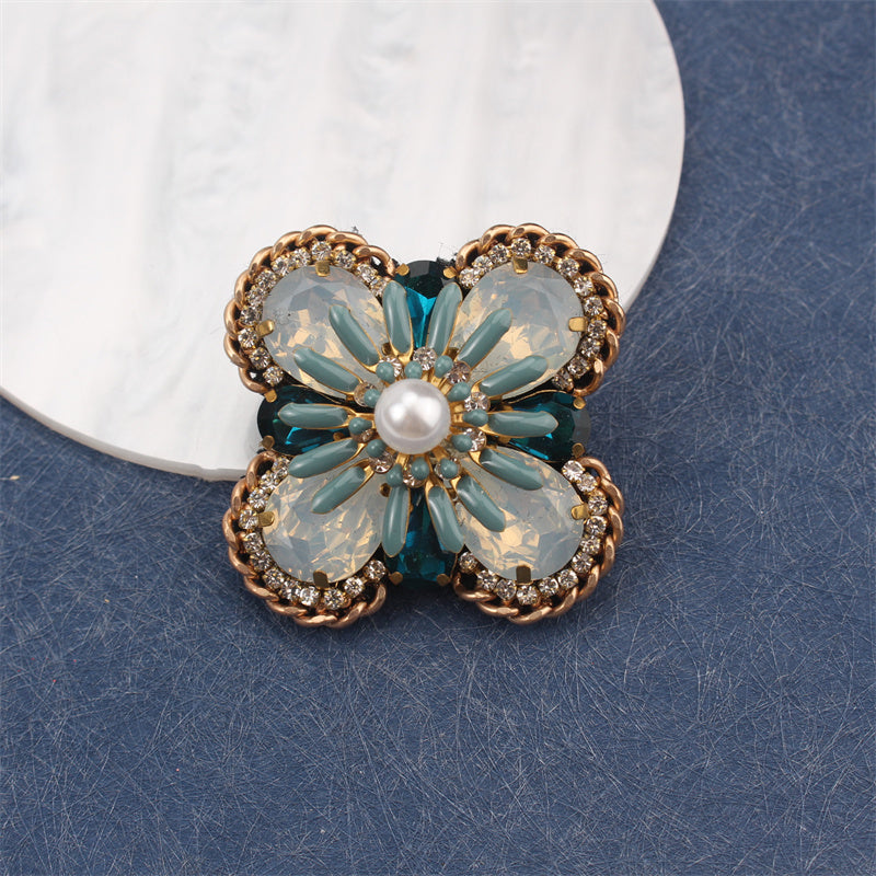 Creative statement jewelry with gemstone accents, a vintage-inspired bohemian floral enamel brooch pin designed for women.