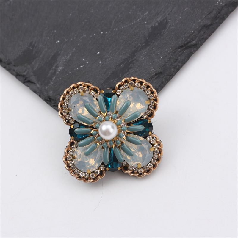 Creative statement jewelry with gemstone accents, a vintage-inspired bohemian floral enamel brooch pin designed for women.